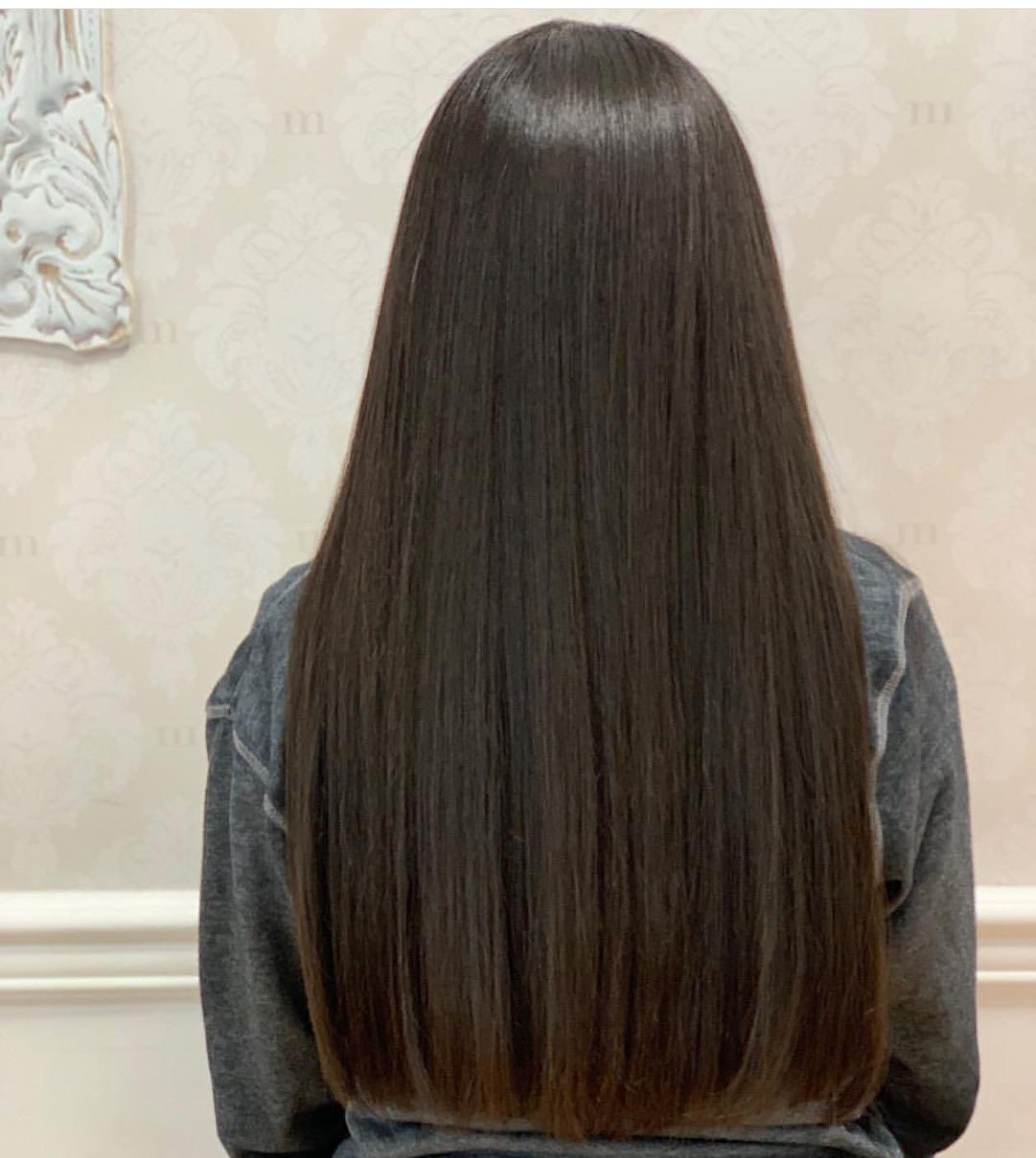 Long, sleek hair finished with a signature blowout