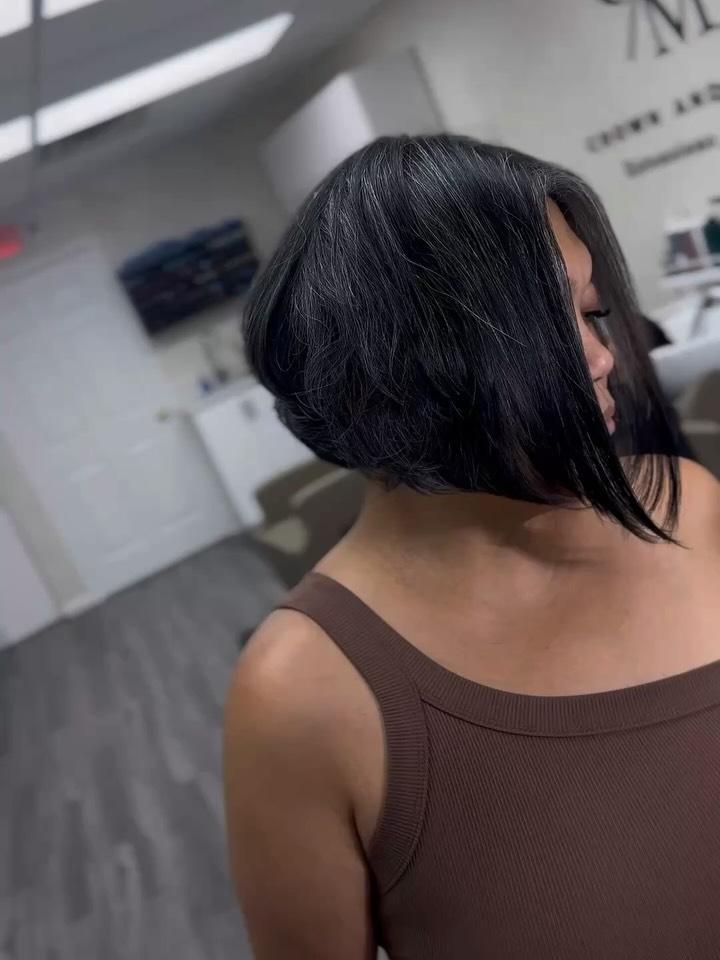 A precision black bob cut with a high-shine finish