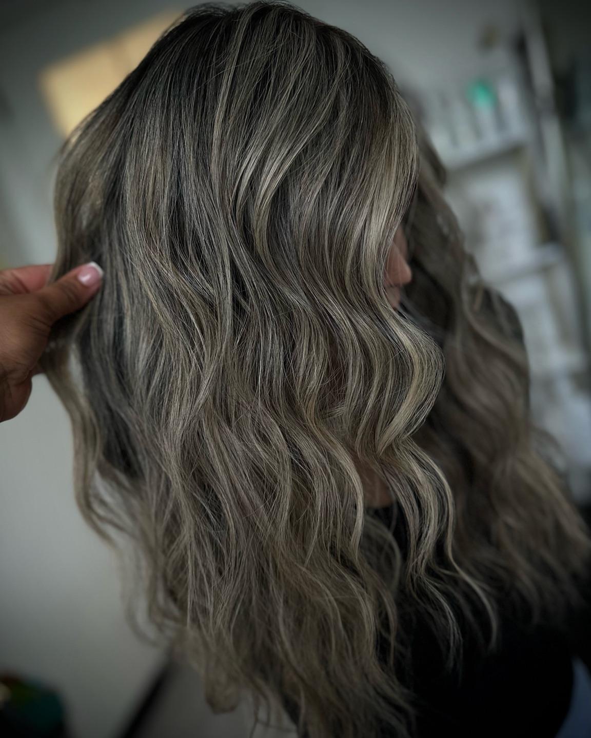 Close view of hand-tied row placement blended into natural hair